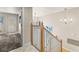 Bright stairwell with wood and white railings and an open view to the landing area with a doorway at 4522 W North B St, Tampa, FL 33609