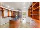 Spacious walk-in closet features custom shelving, storage drawers, an island, and beautiful tile flooring at 4522 W North B St, Tampa, FL 33609