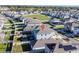 This is an aerial shot of the home and its relation to the surrounding neighborhood at 5571 Birch River Trl, Wesley Chapel, FL 33545