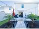 Beautiful backyard showcases a paved patio, lush landscaping, and a cozy hammock for ultimate relaxation at 5571 Birch River Trl, Wesley Chapel, FL 33545