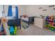 bedroom featuring twin beds, colorful toys, and ample storage space at 5571 Birch River Trl, Wesley Chapel, FL 33545
