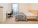 Bright bedroom featuring a work station with desk, modern chair, and comfortable bed at 5571 Birch River Trl, Wesley Chapel, FL 33545