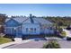 Attractive clubhouse with a welcoming entrance, well-maintained landscaping, and ample parking in a serene setting at 5571 Birch River Trl, Wesley Chapel, FL 33545