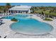 Stunning community pool and clubhouse with ample seating, landscaping, and resort-style amenities for residents at 5571 Birch River Trl, Wesley Chapel, FL 33545