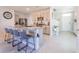Modern kitchen featuring a large island, stainless steel appliances, and plenty of counter space at 5571 Birch River Trl, Wesley Chapel, FL 33545
