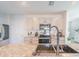 Bright kitchen showcasing granite countertops, stainless steel appliances, and ample cabinet space at 5571 Birch River Trl, Wesley Chapel, FL 33545