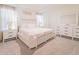 Bright, spacious bedroom with large bed, dresser, and bedside tables offering a comfortable retreat at 5571 Birch River Trl, Wesley Chapel, FL 33545