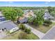 This aerial view showcases the home, its mature landscaping and the surrounding neighborhood at 5907 Tampa Shores Blvd, Tampa, FL 33615