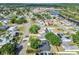 This aerial image reveals the home's location in a neighborhood near tree-lined streets, canals, and waterfront areas at 5907 Tampa Shores Blvd, Tampa, FL 33615