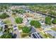 An aerial shot of the property surrounded by a neighborhood, highlighting the proximity to waterfront canals at 5907 Tampa Shores Blvd, Tampa, FL 33615