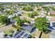 Aerial view shows a home situated in a neighborhood close to canals and waterfront amenities, offering a serene setting at 5907 Tampa Shores Blvd, Tampa, FL 33615