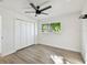 Bedroom with closet featuring light colored vinyl floors and a window with natural light at 5907 Tampa Shores Blvd, Tampa, FL 33615