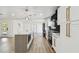 Updated kitchen with large island, stainless appliances, and modern pendant lighting at 5907 Tampa Shores Blvd, Tampa, FL 33615