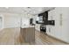 Modern kitchen featuring a large island, stainless steel appliances, and pendant lighting at 5907 Tampa Shores Blvd, Tampa, FL 33615