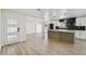 Modern, open-concept kitchen featuring stainless steel appliances and stylish countertops with seating at 5907 Tampa Shores Blvd, Tampa, FL 33615