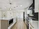 Stunning kitchen with large island, stainless appliances, and stylish pendant lighting at 5907 Tampa Shores Blvd, Tampa, FL 33615
