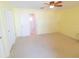 Bright bedroom featuring a ceiling fan and large closets with neutral carpet and trim at 5925 Shore S Blvd # 608, Gulfport, FL 33707