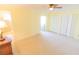 Carpeted bedroom with a glimpse into an adjoining bathroom and multiple closets at 5925 Shore S Blvd # 608, Gulfport, FL 33707