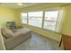 Sunlit bedroom with large windows overlooking the water, creating a peaceful retreat to unwind and relax at 5925 Shore S Blvd # 608, Gulfport, FL 33707