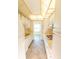 Efficient kitchen design features white cabinets, white appliances, and neutral countertops, with seamless transition to the next room at 5925 Shore S Blvd # 608, Gulfport, FL 33707