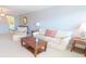 Comfortable living room featuring a plush sofa, armchair, wooden coffee table, and neutral color palette at 5925 Shore S Blvd # 608, Gulfport, FL 33707