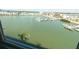 Scenic water views from the interior, showcasing the tranquil bay and boat marina in the backdrop at 5925 Shore S Blvd # 608, Gulfport, FL 33707