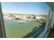 Picturesque water views, offering a serene scene of docked boats and waterfront buildings from the window at 5925 Shore S Blvd # 608, Gulfport, FL 33707