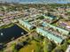 Expansive aerial view of the community, pool, ponds, and surrounding neighborhood at 6123 113Th St # 510, Seminole, FL 33772