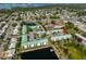 Aerial view of a condo community with lake and surrounding neighborhood at 6123 113Th St # 510, Seminole, FL 33772