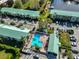 Overhead view of condo community with pool, parking, and green spaces at 6123 113Th St # 510, Seminole, FL 33772