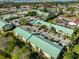 Aerial view of condo buildings with pool and lush surrounding landscape at 6123 113Th St # 510, Seminole, FL 33772