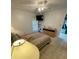 Comfortable bedroom featuring a ceiling fan and a small TV on a shelf at 6123 113Th St # 510, Seminole, FL 33772