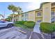 Condominium building with well-maintained landscaping, visible parking, and clear unit number signage at 6123 113Th St # 510, Seminole, FL 33772