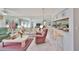Bright living room with mirrored wall, comfortable seating, and a decorative bar area with seating at 6123 113Th St # 510, Seminole, FL 33772