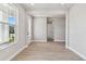 Bright, empty room with modern floors, large window and new construction at 671 Allora Ave, Nokomis, FL 34275