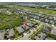 An aerial view of a neighborhood with ponds shows property location at 6907 Crestpoint Dr, Apollo Beach, FL 33572