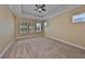 Cozy bedroom offers a trey ceiling, plantation shutters, and a spacious layout at 6907 Crestpoint Dr, Apollo Beach, FL 33572