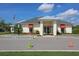 Exterior of the community clubhouse showcasing its well-maintained facade, and ample parking at 6907 Crestpoint Dr, Apollo Beach, FL 33572