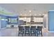 Spacious kitchen with granite island, stainless appliances, and seamless layout to living area at 6907 Crestpoint Dr, Apollo Beach, FL 33572