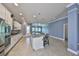 Bright, modern kitchen with island seating, stone countertops and stainless steel appliances at 6907 Crestpoint Dr, Apollo Beach, FL 33572