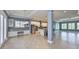 Bright, open-concept living space with recessed lighting, tile floors, and smooth flow to kitchen at 6907 Crestpoint Dr, Apollo Beach, FL 33572