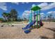 A playground structure with slide and balance beam offers a fun and active play area for children at 6907 Crestpoint Dr, Apollo Beach, FL 33572
