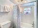 Full bath features shower and tub combination, plus niche storage for toiletries at 714 W Peninsular St, Tampa, FL 33603