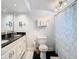 Elegant bathroom with a double sink vanity, modern fixtures, and stylish shower curtain at 714 W Peninsular St, Tampa, FL 33603