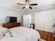 Bedroom view featuring hardwood floors, a ceiling fan, and closet at 714 W Peninsular St, Tampa, FL 33603