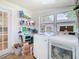 Bright laundry room featuring modern washer and dryer, and tile floors at 714 W Peninsular St, Tampa, FL 33603