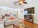 Spacious living room with hardwood floors, comfortable seating, and a modern entertainment center at 714 W Peninsular St, Tampa, FL 33603