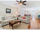 Bright living room with hardwood floors, neutral-toned sofas, and an open layout, perfect for entertaining guests at 714 W Peninsular St, Tampa, FL 33603