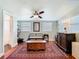 Relaxing sitting room featuring a ceiling fan, bench seating, and large windows with natural light at 714 W Peninsular St, Tampa, FL 33603