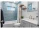 Modern bathroom with stylish blue tile, updated fixtures, and a clean, contemporary design at 731 44Th Ne Ave, St Petersburg, FL 33703
